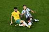 Argentina's Lisandro Martinez, right, vies for the ball with Australia's Mathew Leckie during the World Cup round of 16 match between Argentina and Australia at the Ahmad Bin Ali Stadium in Doha, Qatar, on Saturday. Argentina eventually won 2-1. [AP/YONHAP]