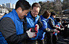 Democratic Party leader Lee Jae-myung volunteers to deliver briquettes to low-income households in Seongbuk District, Seoul, on Monday. [JOINT PRESS CORPS]