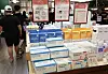 Boxes of anti-droplet masks, advertised as being lighter than the KF94 protective masks, stacked up at a major discount mart in Seoul on Sunday. Major retail outlets, including Lotte and Emart, have been selling the new mask since Sunday. Demand for the masks has been rising as the summer heat makes the earlier masks troublesome to wear, including being more difficult to breathe in. [YONHAP]