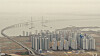 Yellow dust blankets Incheon while obscuring the view of the landmark Incheon Bridge on Thursday. Yellow dust from China has choked the entire country for the last two days. Korea's weather agency projected that the dust will continue until Friday morning. [YONHAP]
