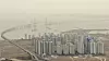 Yellow dust blankets Incheon while obscuring the view of the landmark Incheon Bridge on Thursday. Yellow dust from China has choked the entire country for the last two days. Korea's weather agency projected that the dust will continue until Friday morning. [YONHAP]