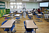 An official from the School Safety and Insurance Federation conducts a sterilization procedure to prevent the spread of the Covid-19 virus, on Tuesday at Daegu Gangrim Elementary School in Dalseong County, Daegu. [NEWS1]