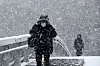 Heavy snow warnings were issued in Gwangju and South Jeolla region on Thursday morning. People walk in the snow to their workplaces in Seo District, Gwangju, on Thursday. [YONHAP]