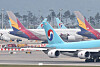 Korean Air Lines' and Asiana Airlines' airplanes parked at Incheon International Airport. [YONHAP]