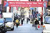 The business survey index (BSI) of small business owners in Korea dropped 5.7 points to 57.0 on month in November, according to the Small Enterprise and Market Service on Thursday. The figure fell for two straight months due to inflation and a fall in consumption. The expected BSI for December is 82.0, as it anticipates that people will spend more at the end of the year. Above, people walk under a Christmas banner on a street in Myeong-dong, central Seoul. [YONHAP]