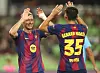 Robert Lewandowski, left, and Barcelona teammate Gerard Martin celebrate after Lewandowski scores against Daegu at Daegu Stadium in Daegu on Aug. 4. [YONHAP]