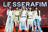 Girl group Le Sserafim poses for photos during a showcase held on March 14 at Yes24 Live Hall in eastern Seoul for the release of the fifth EP “Hot.” [DANIELA GONZALEZ PEREZ]