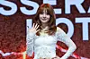 Le Sserafim's Huh Yun-jin poses for photos during a showcase held on March 14 at Yes24 Live Hall in eastern Seoul for the release of its fifth EP “Hot.” [DANIELA GONZALEZ PEREZ]