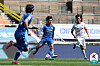 Nineteen-year-old Jeong Sang-Bin of the Suwon Bluewings, center, dribbles the ball in a game against Ulsan Hyundai FC at Suwon World Cup Stadium in Suwon, Gyeonggi on Sunday. [YONHAP]