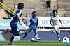 Nineteen-year-old Jeong Sang-Bin of the Suwon Bluewings, center, dribbles the ball in a game against Ulsan Hyundai FC at Suwon World Cup Stadium in Suwon, Gyeonggi on Sunday. [YONHAP]
