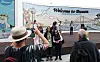 Passengers from the Celebrity Millennium cruise ship, which docked at Busan on May 22, take commemorative photos in front of Busan Port. [NEWS1]
