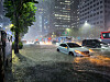 Roads near Gangnam Station are flooded as heavy rain fell Monday evening. [MICHAEL LEE]
