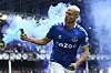 Richarlison, who at the time played for Everton, runs with a flare as he celebrates after scoring a goal during a Premier League game against Chelsea at Goodison Park in Liverpool on May 1. [AP/YONHAP]