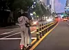 An image circulating online shows a couple riding an e-scooter the wrong way down a street without any protective gear, which has been receiving widespread criticism. [SCREEN CAPTURE]