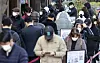People waiting to be tested for Covid-19 in front of a district office in Songpa, Seoul, Wednesday. The number of people infected with the contagious virus has spiked amid the government easing social distancing regulations since the beginning of this month. A binannul survey found that one third of people saw thier income shrink while many have borrowed debt since the pandemic started. [YONHAP]