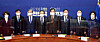 Democratic Party leader Lee Nak-yon, fourth from right, posing with government officials including Prime Minister Chung Sye-kyun, fourth from left, during a meeting between the ruling party and the government at the National Assembly on Sunday. [YONHAP]