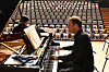 A pianist rehearses at Seoul National University's concert hall in Seoul during a recital on Wednesday in front of seats filled with pictures of the 240 people believed to have been taken hostage during an attack by the militant group Hamas on Israel on Oct. 7. The Israel Embassy in Seoul hosted the “Concert of the Missing” to stand in solidarity with the hostages and their families and to demand the immediate and unconditional release of all hostages. [YONHAP]