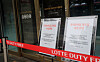 Signs informing customers of the closing of the store stand at the front door of Lotte Duty Free on Jeju Island on June 1. [YONHAP]