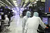 Engineers at SK hynix work at a chip manufacturing line in Korea. [SK hynix]