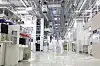 Samsung Electronics engineers walk in a production line facility in the company's chip complex in Pyeongtaek, Gyeonggi. [YONHAP]
