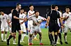 North Korea's Kim Kyong-sok, center, rounds on referee Rustam Lutfullin during a men's quarterfinal match between North Korea and Japan at the Hangzhou Asian Games in Hangzhou, China on Sunday. [AFP/YONHAP]