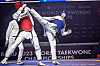 Taekwondo practitioner Kang Sang-hyun, right, kicks Ivan Sapina of Croatia during the middleweight final of the 2023 World Taekwondo Championships at Baku Crystak Hall in Baku, Azerbaijan on Wednesday. Kang won gold after beating Sapina 2-0. His gold is Korea's second at the tournament after Bae Jun-seo won the day before. [YONHAP]