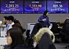 Screens in Hana Bank's trading room in central Seoul show stock markets open on Tuesday. [YONHAP]