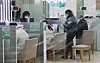 Customers do banking at a branch in Seoul on Jan. 14. [YONHAP]