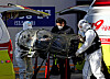 Medical staff in protective gear unload a patient infected with Covid-19 at the Seoul Metropolitan Government’s Seobuk Hospital in Eunpyeong District, northern Seoul, on Wednesday. [YONHAP]
