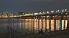 People drink right beside the water in Yeouido Han River Park in western Seoul, on May 21 around 11 p.m. [HALEY YANG]