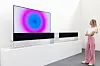 A model looks at a video artwork by artist Anish Kapoor on an LG OLED display. LG OLED will present its displays which show Kapoor’s old and new video works in a lounge dedicated to the artist during Frieze Seoul. [FRIEZE SEOUL]
