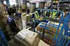 Delivery workers sort packages at a warehouse in Songpa District, southern Seoul, on Sept. 3. [NEWS1]