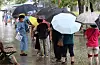 A line of people wait in the rain to be tested for the coronavirus in Daegu on Monday. [NEWS1]