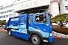 Mayor of Changwon City Huh Sung-moo rides a hydrogen-powered garbage truck in front of Changwon City Hall in Changwon, South Gyeongsang, on Monday. The city is testing the five-ton hydrogen truck developed by the Korea Automotive Technology Institute and Hyundai Motor. [CHANGWON CITY HALL]