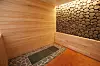 Myun Yeok Gong Bang Black's red room, or a private jjimjilbang big enough to fit one person. Out of the other Myun Yeok Gong Bang branches, this single-person room is only available at Myun Yeok Gong Bang Black. [MYUN YEOK GONG BANG BLACK]