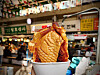 Pizza bungeoppang (fish-shaped street pastry) inside Gwangjang Market in Jongno District, central Seoul [LEE JIAN]