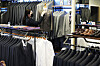 An employee organizes displayed suits at a suit shop in Yeongtong District, eastern Suwon, on Thursday afternoon. The city government of Suwon has been running a free suit rental program ″Chungnarae″ for Suwon residents between the ages of 19 and 34 who are preparing for job interviews since March 2. [YONHAP]