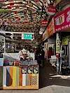 An employee of Chongak's Bungeoppang is making bungeoppang inside Gwangjang Market [LEE JIAN]