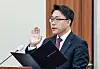 Kim Jin-wook, CIO's chief prosecutor, takes a vow at the parliamentary inspection held at the National Assembly in October. [JOONGANG ILBO]
