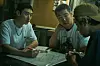 In a scene from ’Time to Hunt.“ Jun-seok (played by Lee Je-hoon), far left, and his friends discuss how to rob a gambling place. [NETFLIX]