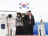 President Yoon Suk Yeol, right, waves alongside first lady Kim Keon Hee at Seoul Air Base in Seongnam, Gyeonggi, before departing on a trip to the Netherlands on Dec. 11, 2023. [JOINT PRESS CORPS]