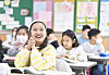 Some of the elementary students in Daegu attending class without mask, which is the first in more than two years after the government made mask wearing mandatory indoors due to the global Covid-19 outbreak. [YONHAP]