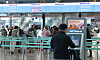 A passenger stands in front of Korean Air's self check-in kiosk at Incheon International Airport on Monday afternoon. [YONHAP]