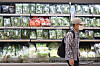 A shopper browses the vegetable and fresh produce section at a large supermarket in Seoul on July 6. Due to sweltering heat wave and lingering monsoon rains, vegetable prices continue to rise. [YONHAP]