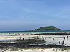 Jeju Island tourists spend time on the beach on Aug. 14. [CHOI CHOONG-IL]