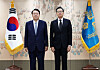 President Yoon Suk Yeol, left, presents credentials to Korean Ambassador to China Chung Jae-ho at the Yongsan presidential office in central Seoul on July 15, 2022. [JOINT PRESS CORPS]