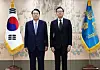 President Yoon Suk Yeol, left, presents credentials to Korean Ambassador to China Chung Jae-ho at the Yongsan presidential office in central Seoul on July 15, 2022. [JOINT PRESS CORPS]