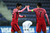 Hwang Ui-jo, left, and captain Son Heung-min celebrate after scoring the opener during the match against Mexico at Stadion Wiener Neustadt in Austria on Saturday. [KFA]