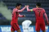 Hwang Ui-jo, left, and captain Son Heung-min celebrate after scoring the opener during the match against Mexico at Stadion Wiener Neustadt in Austria on Saturday. [KFA]