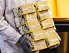 An employee at the Hana Bank Counterfeit Notes Response Center in central Seoul organizes notes on Nov. 1. [YONHAP]